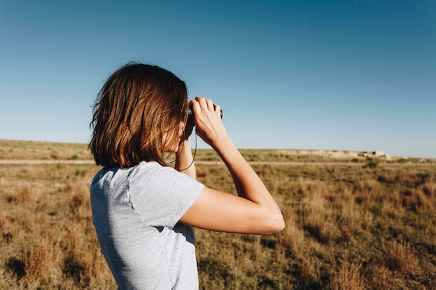 Traveler Using Binoculars