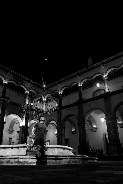 A Traveler visiting the arts center in Queretaro Mexico space for text at the top black and white