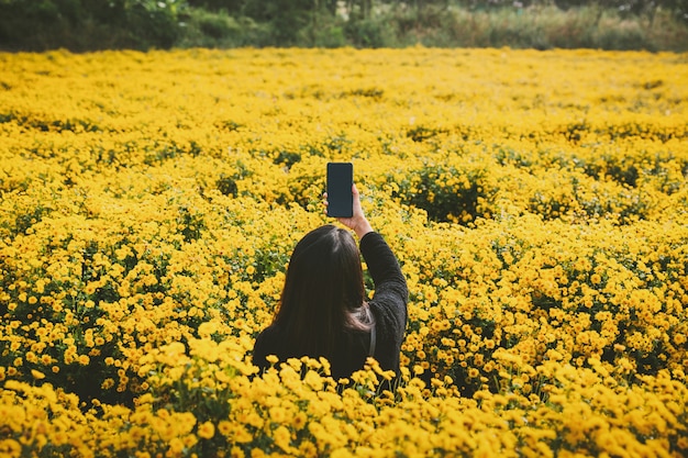 Traveler woman in flower garden