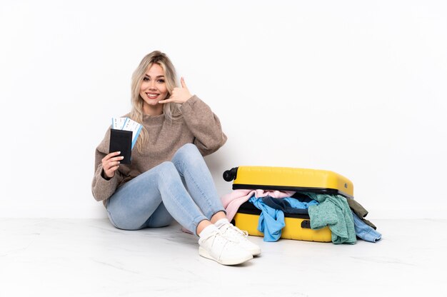 Traveler woman over isolated wall