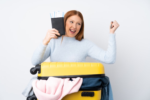 Traveler woman with a suitcase full of clothes