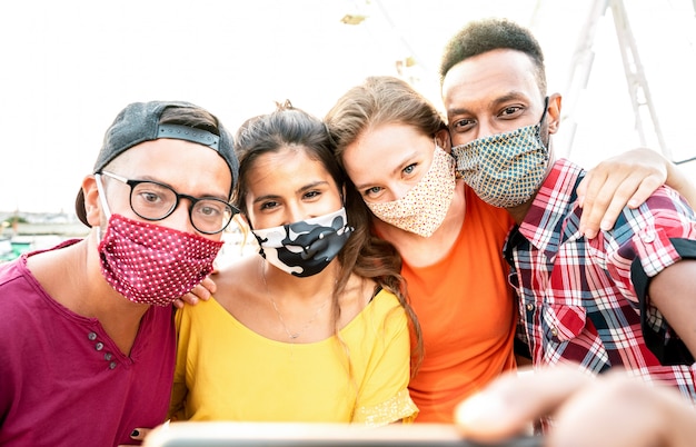 Travelers taking selfie with closed face masks