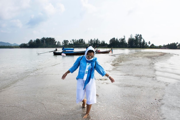 Travelers thai women passenger journey by local wooden long tail boat trip for travel visit Thale Waek San Lang Mangkorn or Separated Sea on Laem Tae Pan in Pak Bara at La ngu city in Satun Thailand