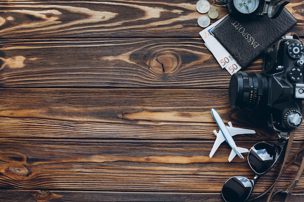 Photo traveling elements on wooden table