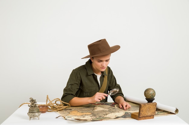 Traveller searching with a magnifying glass
