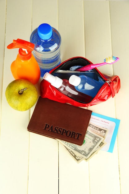 Travelling items on wooden background