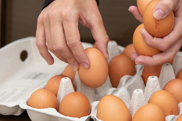 Tray of brown and organic chicken eggs on the table