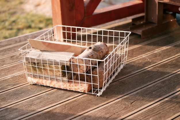 Tray of chopped firewood in a basket