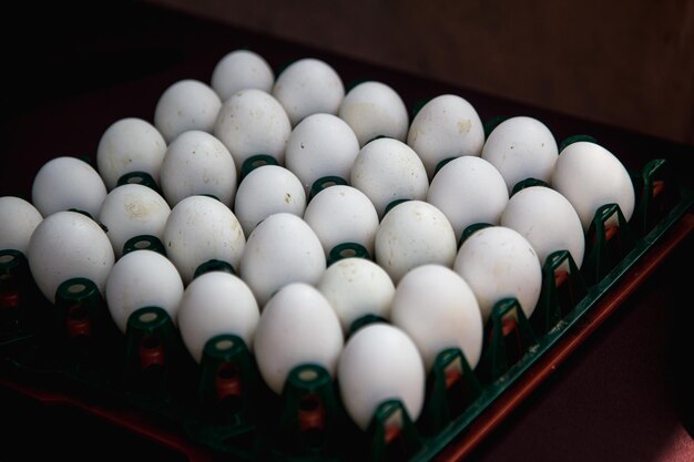A tray of eggs is on a table