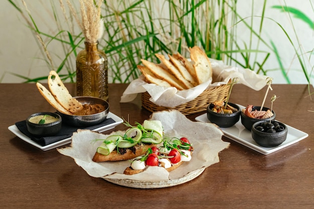 A tray of food with a basket of food on the table.