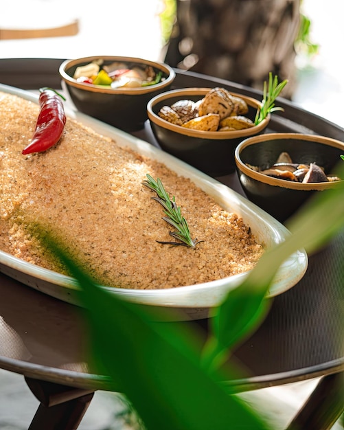 A tray of food with a dish of food on it