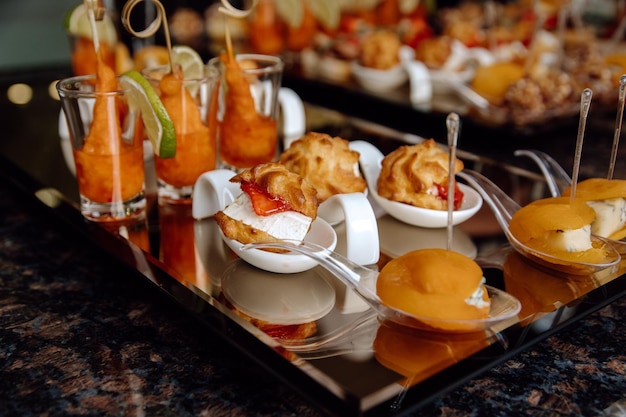 A tray of food with a variety of drinks on it