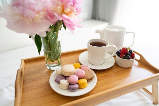 Tray with breakfast on bed.