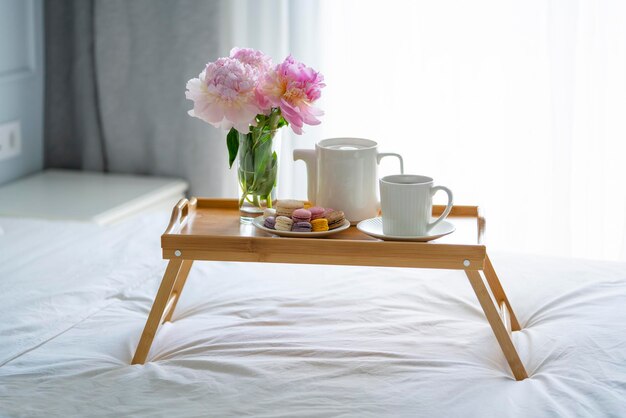 Tray with breakfast on bed.