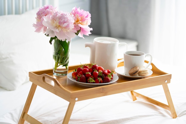 Tray with breakfast on bed.