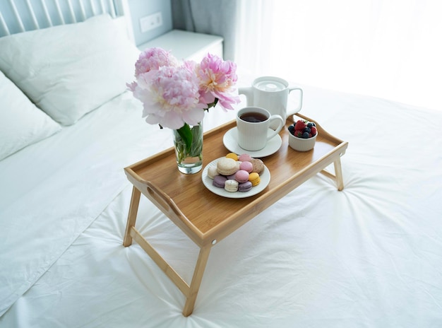 Tray with breakfast on bed