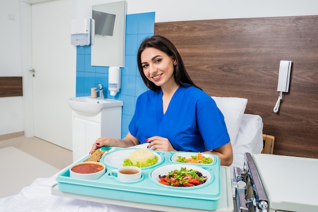 Tray with breakfast for the young female patient.