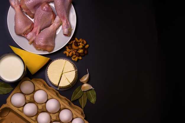 Photo a tray with eggs on a black background. protein diet, fletley. keto.