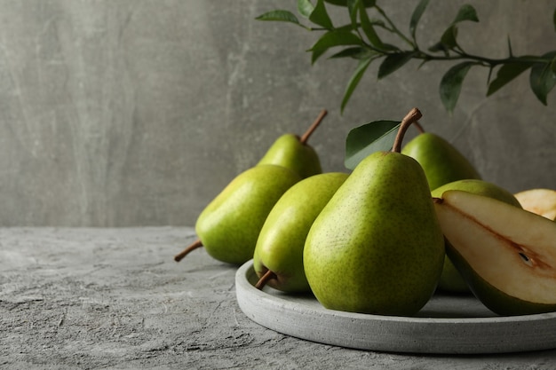 Tray with green pears on gray