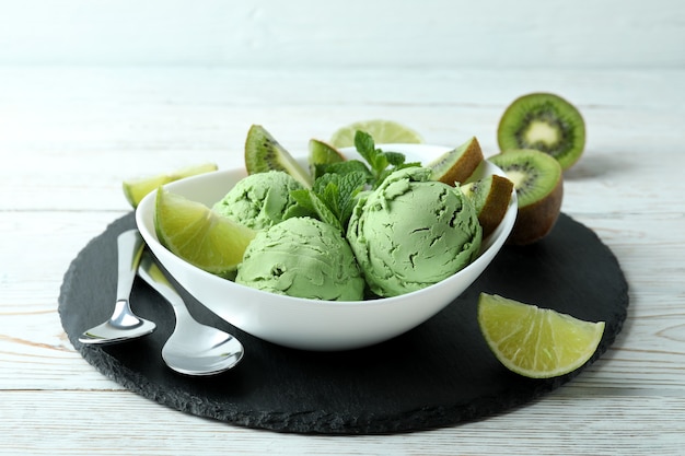 Tray with mint ice cream on white wooden