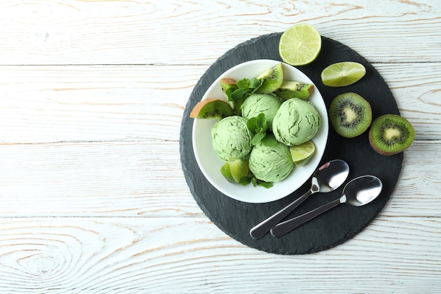 Tray with mint ice cream on white wooden