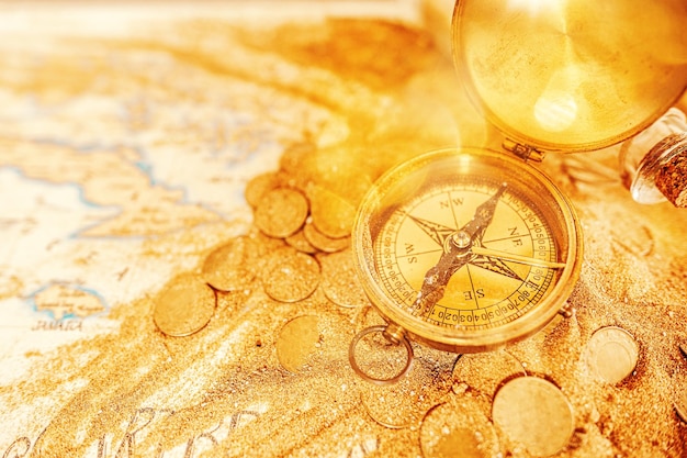 Treasure map with compass and gold coins