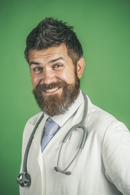 Treatment healthcare medicine and ambulance services concept doctor with beard happy face in white