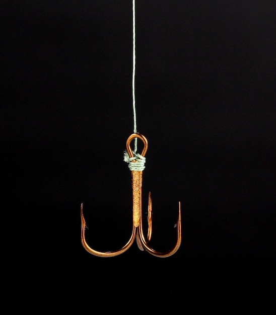 Treble fish hook isolated on black