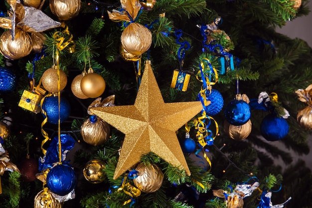 Tree decorated with golden toys and balls, christmas