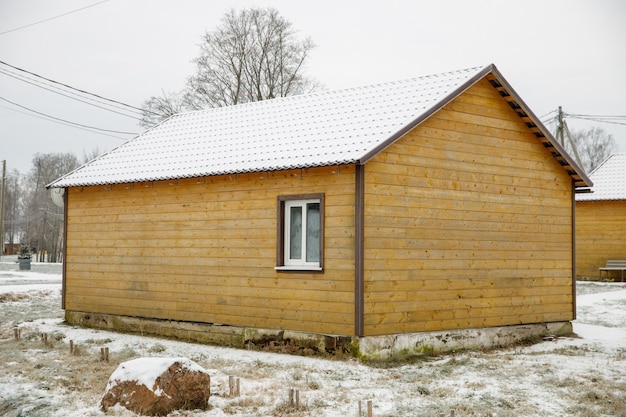 A tree house in the village in winter