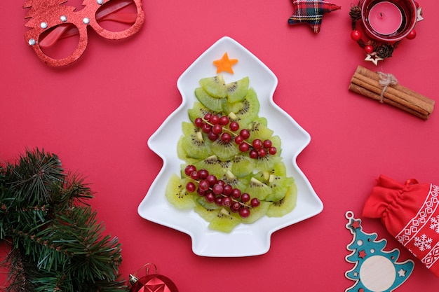  Tree made from kiwi on a white tree plate