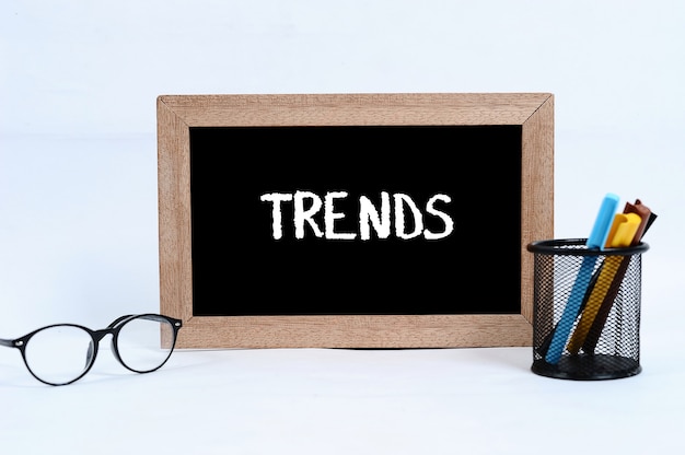 Trends concept written on blackboard