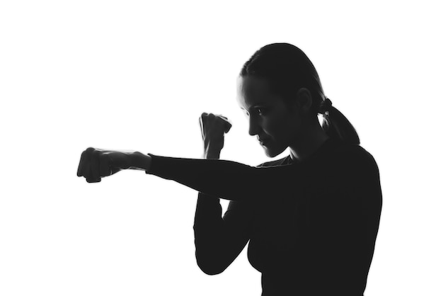 Trendy black and white silhouette portrait of woman defense concept