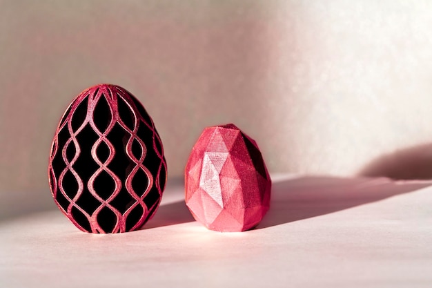 Trendy Easter low poly decor design of 2023 Eggs of geometric style in toning Viva Magenta Happy Easter greeting card Holiday concept in minimal style