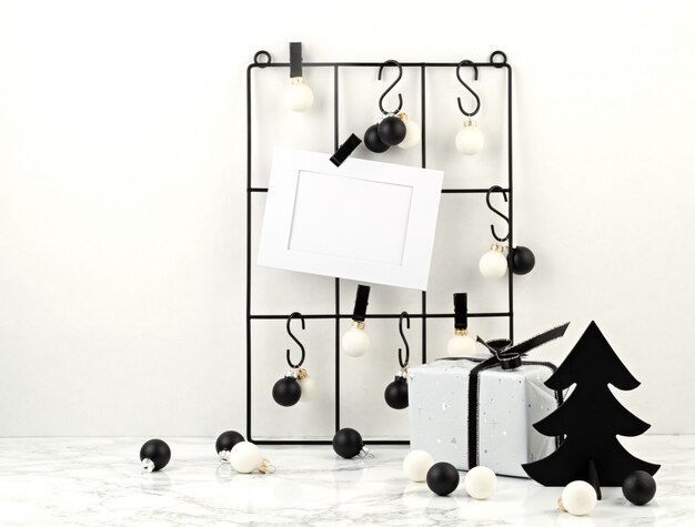 Trendy fashionable christmas decoration with gifts, greeting card and mesh board