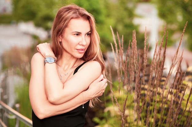 Trendy female posing in the street.