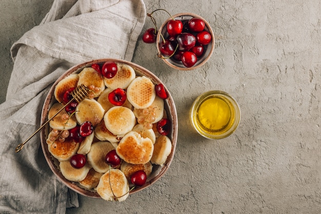 Trendy home breakfast with tiny pancakes