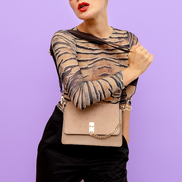 Trendy Lady's accessory clutch. Accent for beige and animal print.