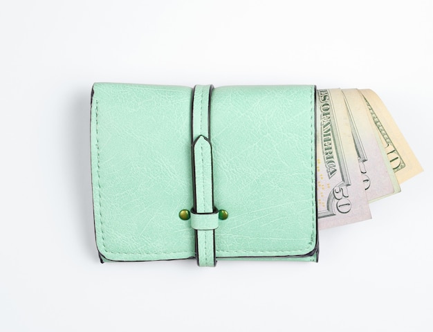 Trendy leather wallet with dollar bills on white.