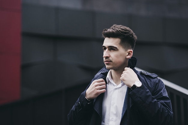 Trendy look. Stylish guy wearing elegant coat and white shirt