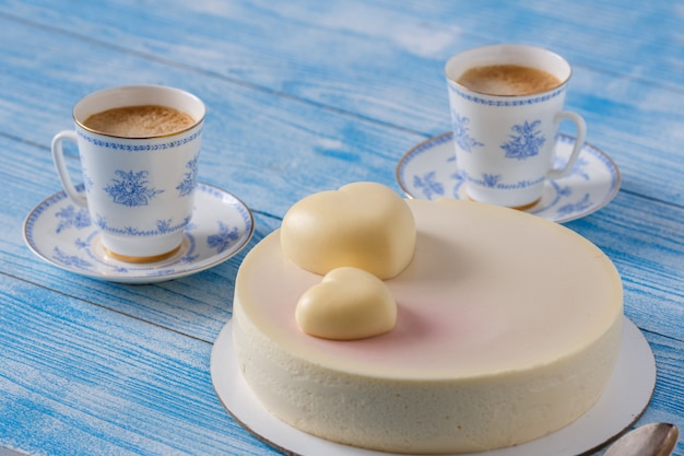 Trendy mousse cake on a wooden table