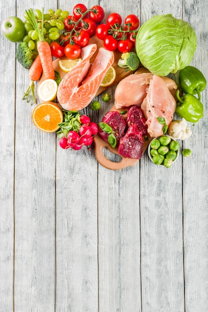 Trendy pegan diet, meat, eggs, seafood, dairy products and various fresh vegetables