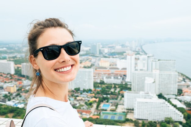 Trendy woman posing in the street