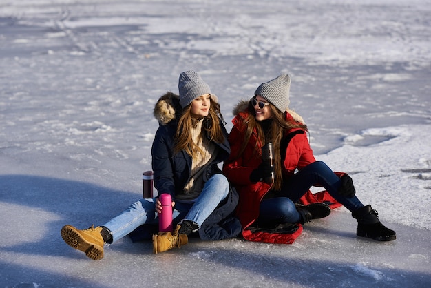 A trendy young girls walk and have a fun outdoor in winter