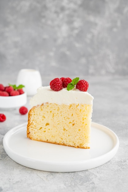 Photo tres leches cake with whipped cream and fresh raspberries on top cake from latin america copy space