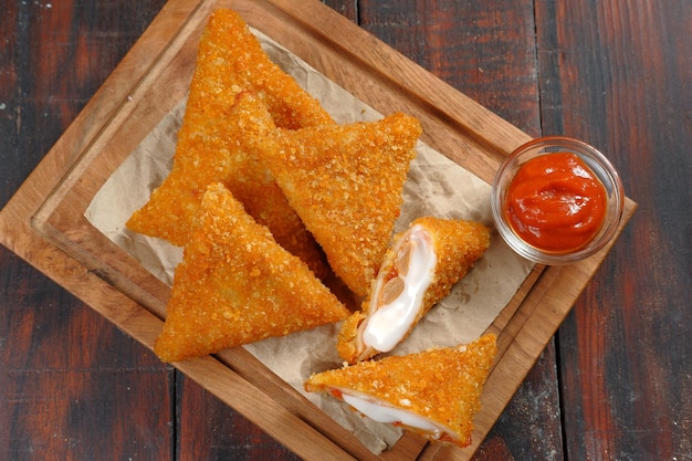 triangle Fried Risoles or Risol mayo is a typical Indonesian traditional street food.