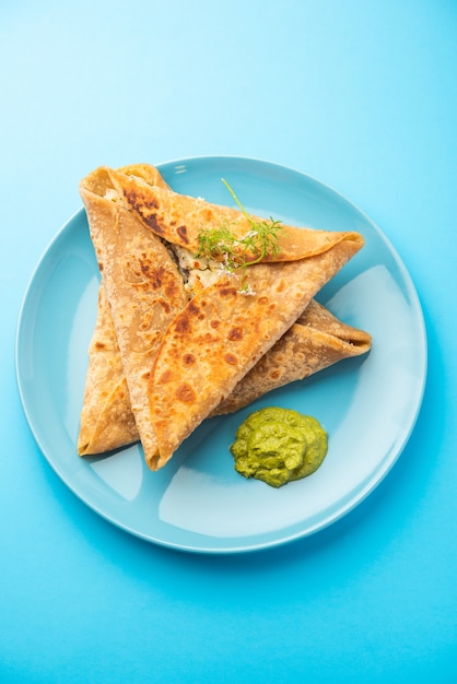 Triangle Paratha Wrap with potato chicken filling served with green chutney, Indian food