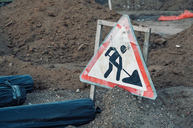 Triangle sign on a construction site signifying road works