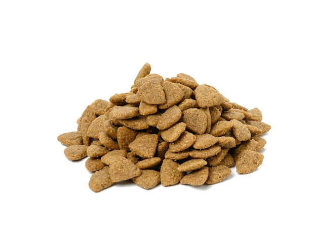 Triangular pieces of animal food on a white background Pile of nutritious food