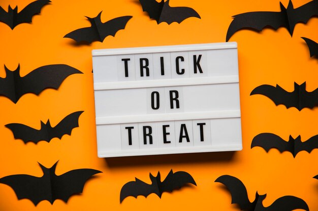 Trick or Treat halloween lightbox message with black scary bats